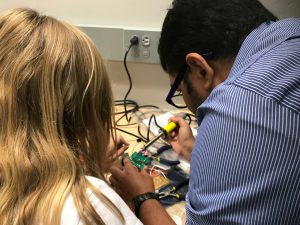 Student learning to solder