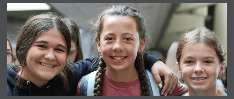 students smiling on the first day of school